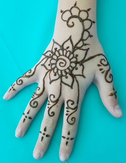 Flower and vines Henna tattoo on hand