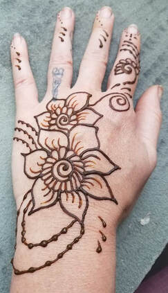 Flower and vines Henna tattoo on hand 11