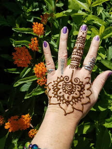 Flower and vines Henna tattoo on hand 3