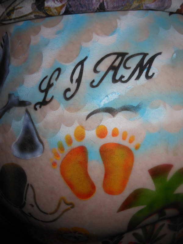 Foot prints belly painting pregnant