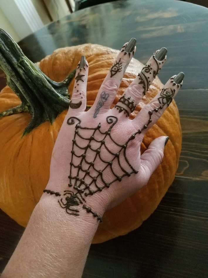 Halloween spider web henna design