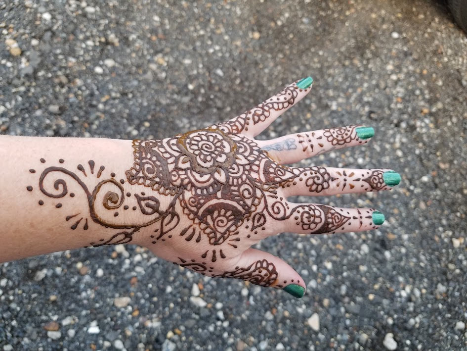 Henna tattoo on hand flower design 1