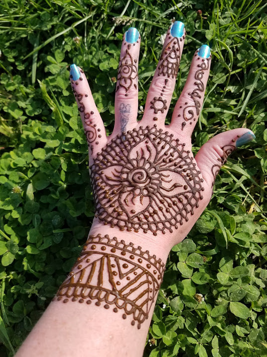 Henna tattoo on hand flower design 3