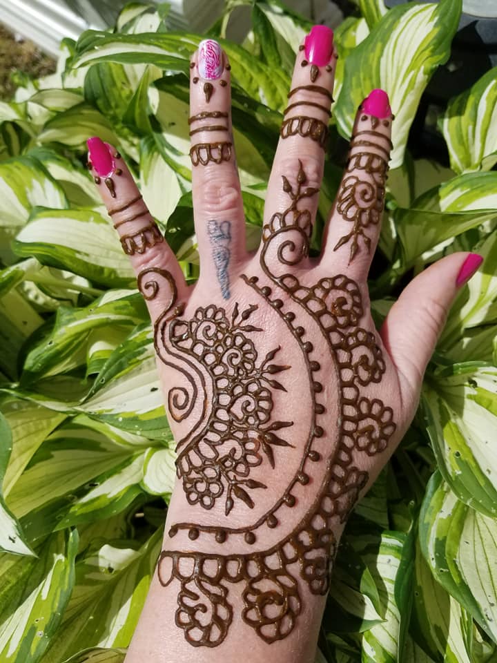 Henna tattoo on hand flower design