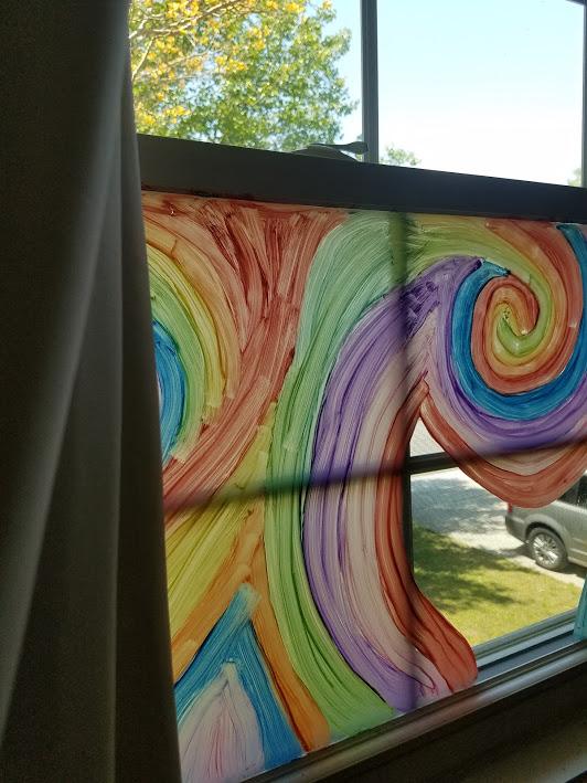 in progress colorful rainbow swirl tie-dye window art