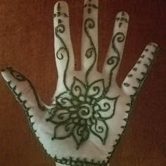 Flower and vines Henna tattoo on hand 4