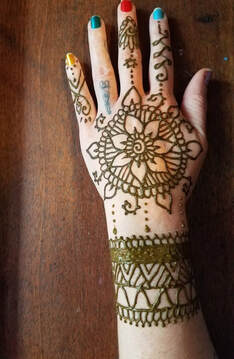Flower and vines Henna tattoo on hand 5