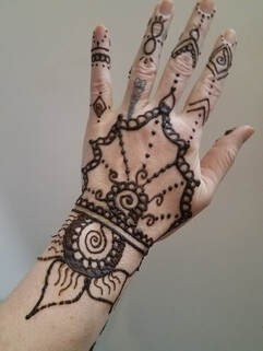 Flower and vines Henna tattoo on hand 7