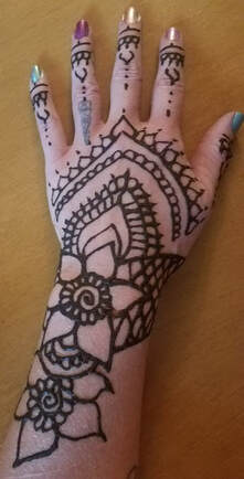 Flower and vines Henna tattoo on hand 8