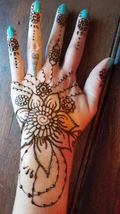 Flower and vines Henna tattoo on hand 9