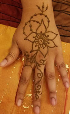 flower henna tattoo on hand